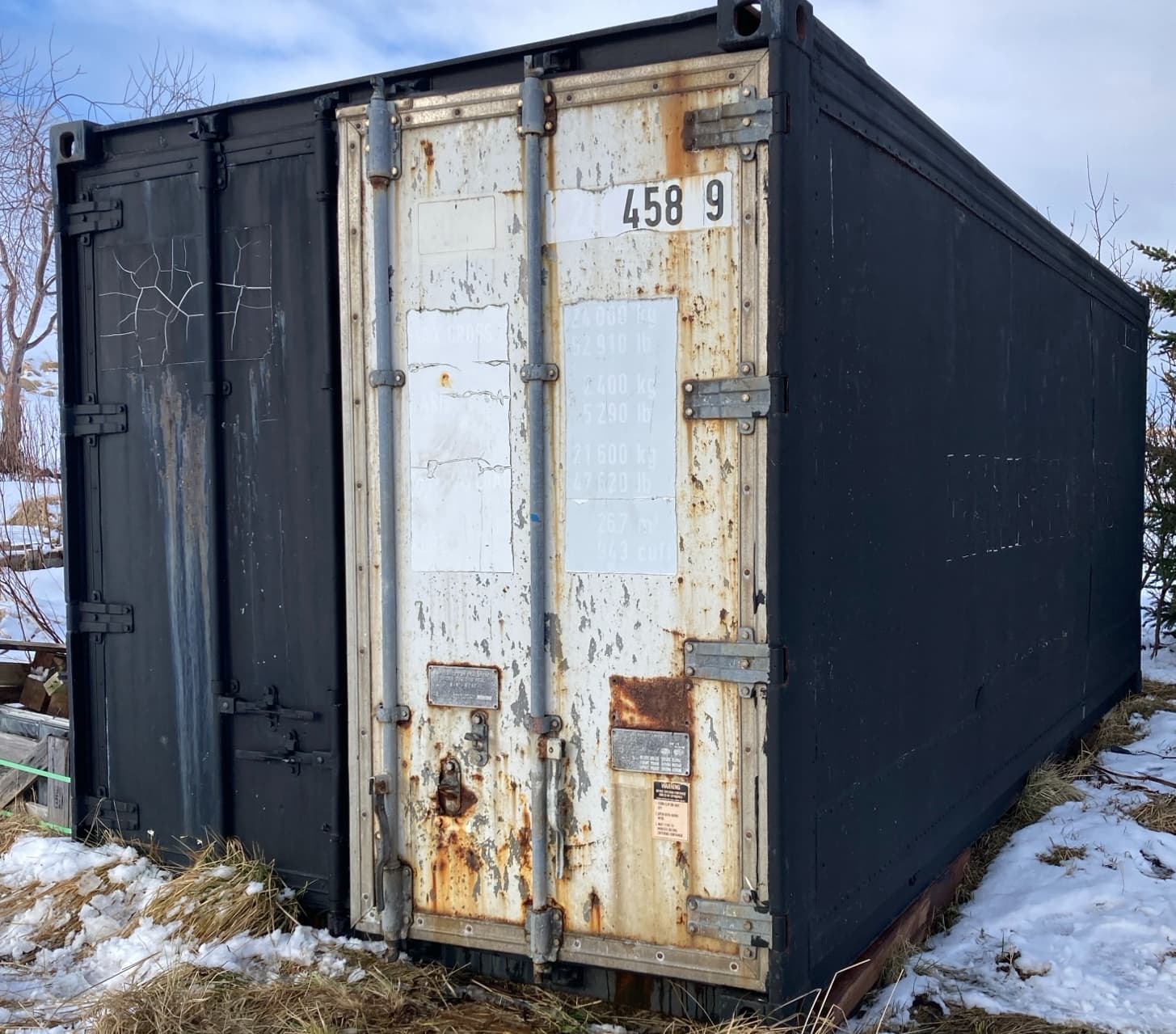 Einangraður gámur